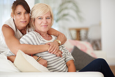 Buy stock photo Portrait, hug and lesbian couple relax in home together for love, support and care. Face, lgbtq and gay women embrace on sofa for connection, loyalty and trust in healthy relationship in living room