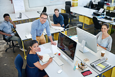 Buy stock photo High angle portrait of a group of designers working at their computers in an office