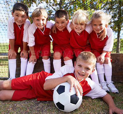 Buy stock photo Portrait of a children's soccer team posing for the team photo