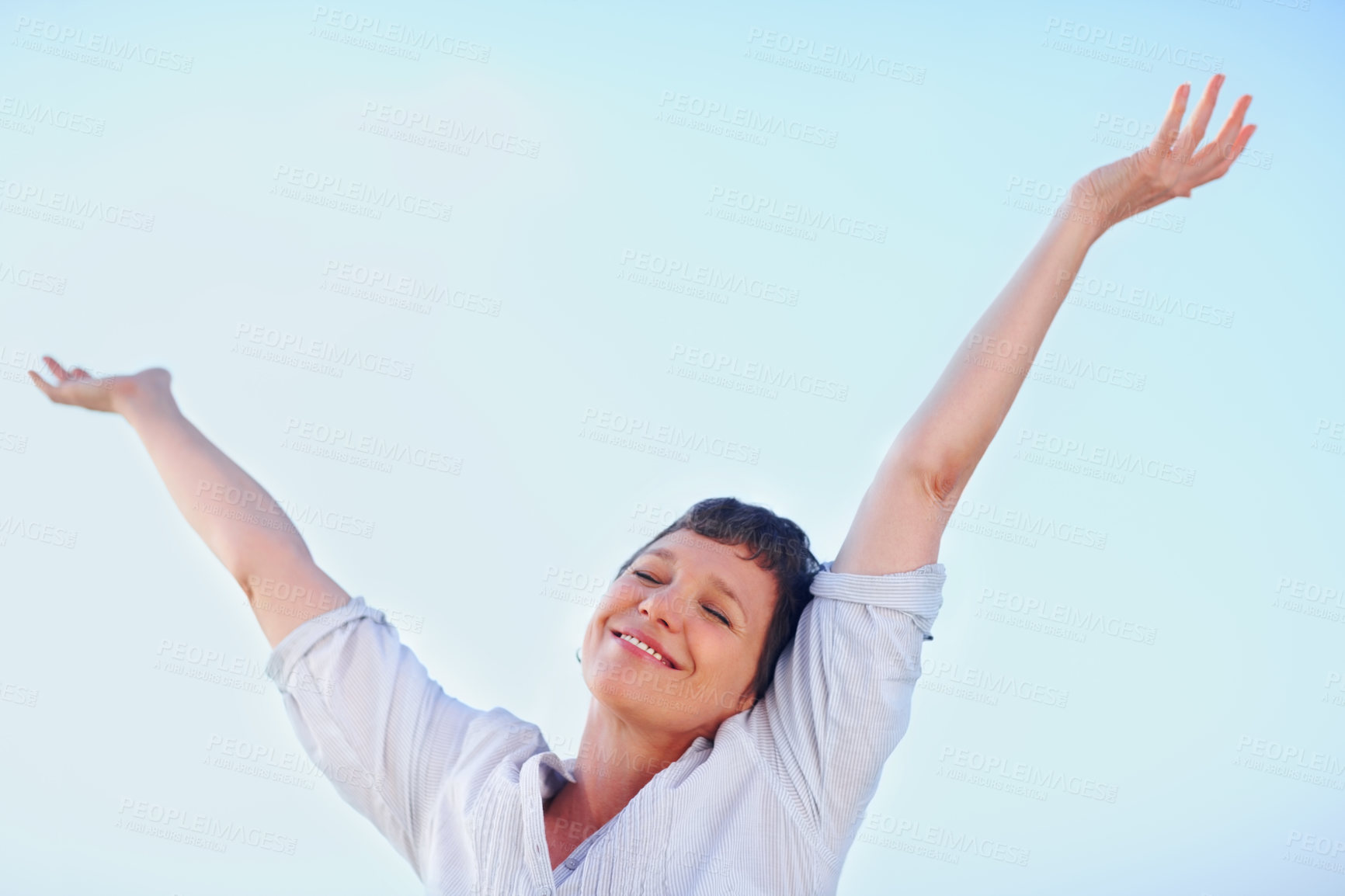 Buy stock photo Mature, woman and cheerful smile on blue sky for holiday, travel or vacation in retirement. Confidence, mockup and space with happy tourist person outdoor in summer for peace, sightseeing or wellness