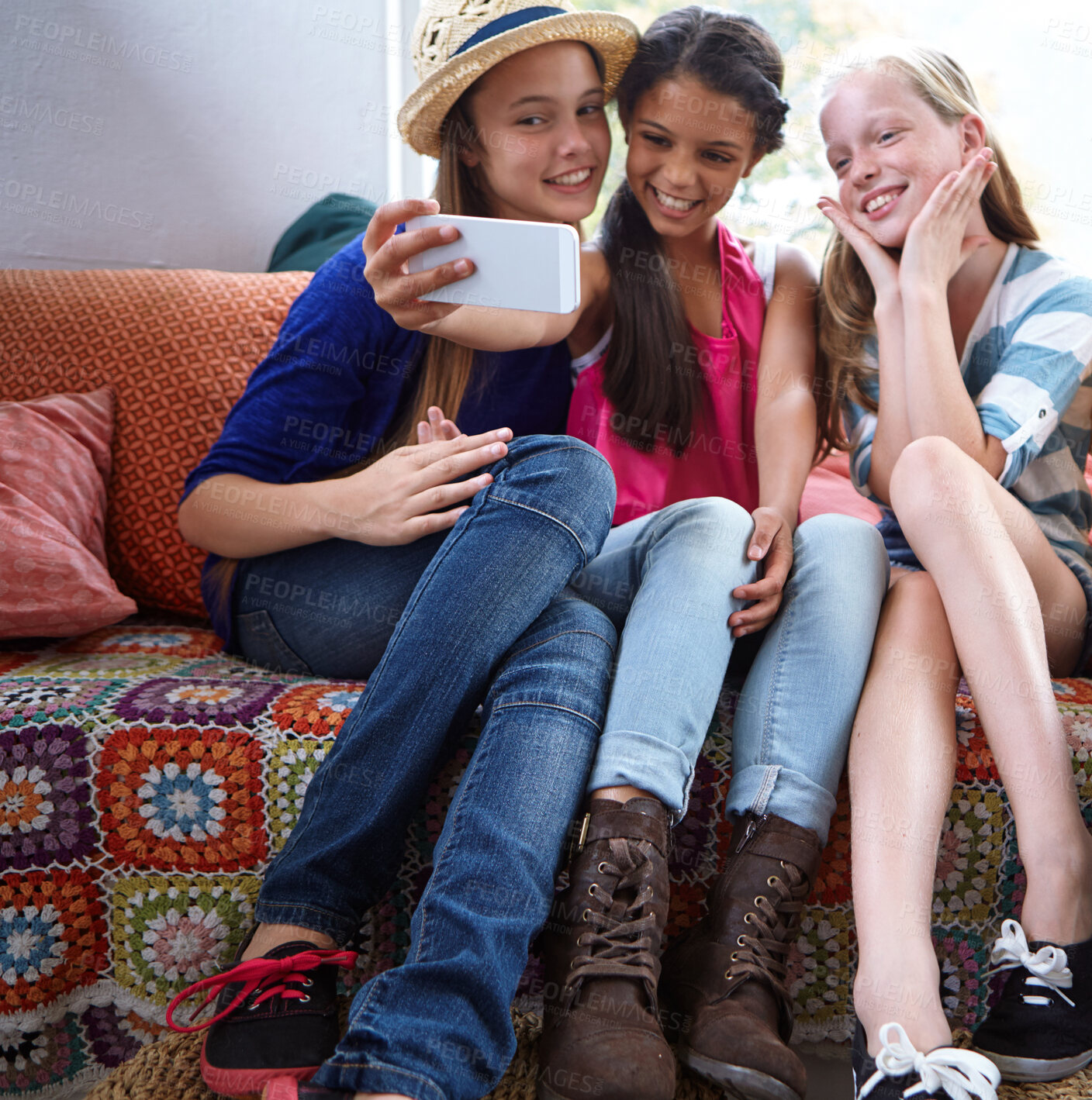 Buy stock photo Shot of a group of teenage friends taking a selfie together