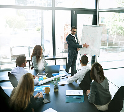 Buy stock photo Shot of a businessman giving a presentation to his colleagues in an office