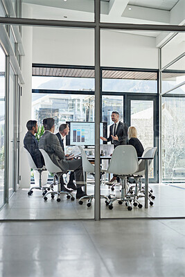 Buy stock photo Shot of corporate businesspeople meeting in the boardroom