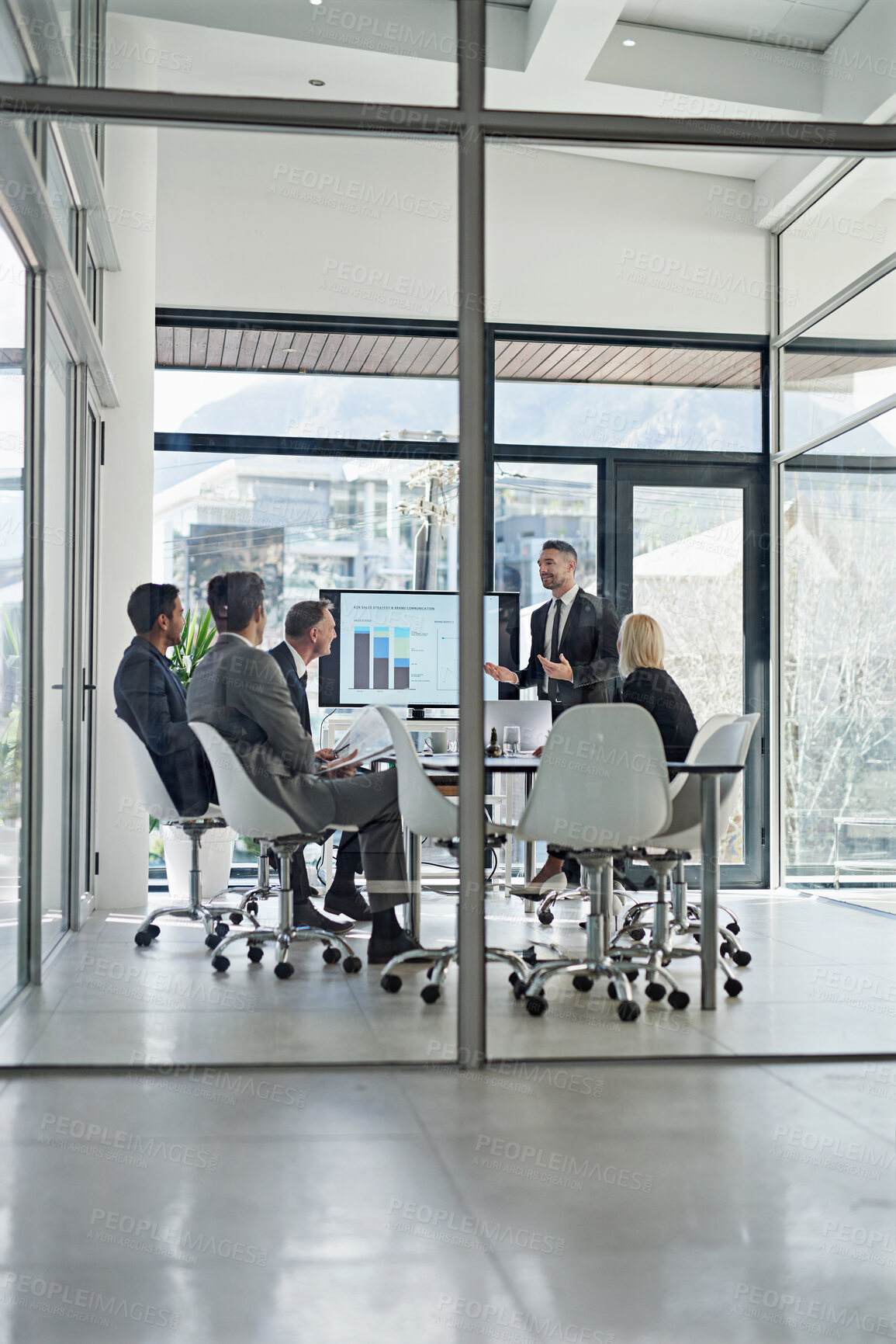 Buy stock photo Shot of corporate businesspeople meeting in the boardroom