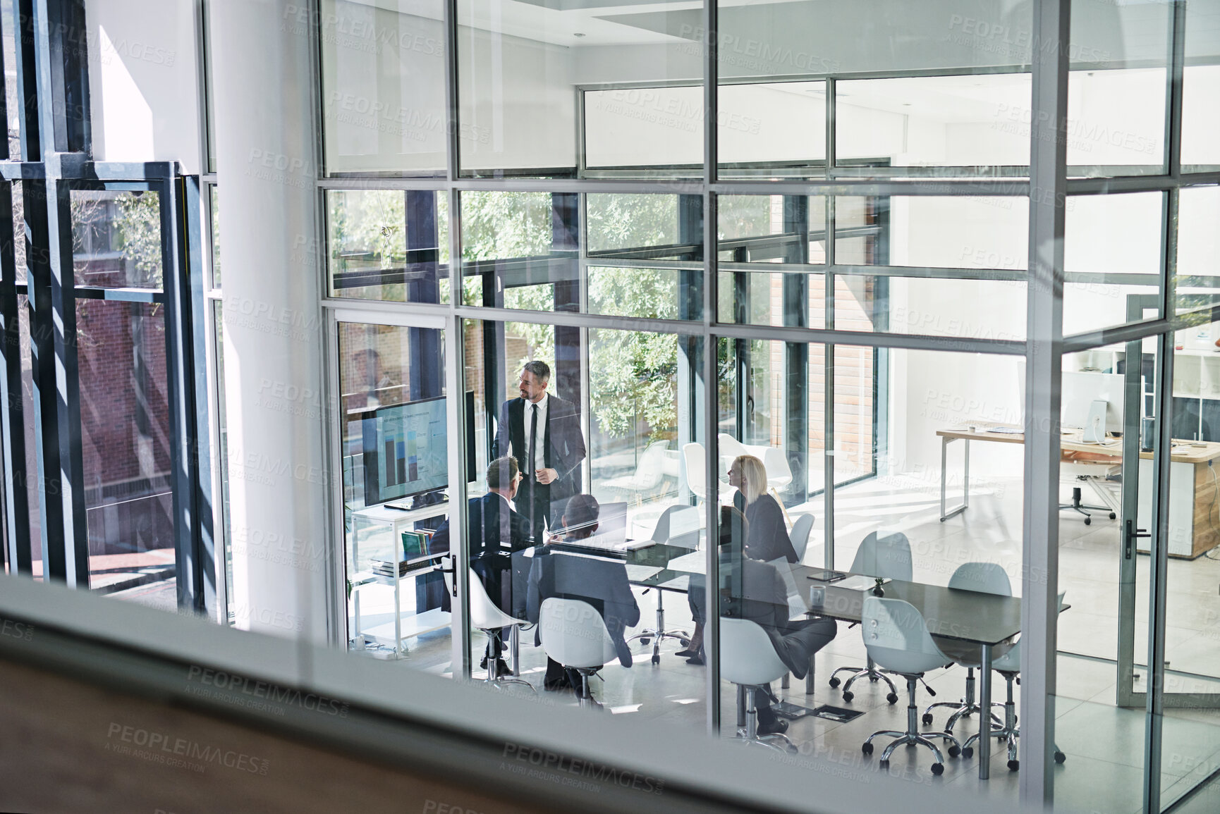 Buy stock photo Shot of corporate businesspeople meeting in the boardroom