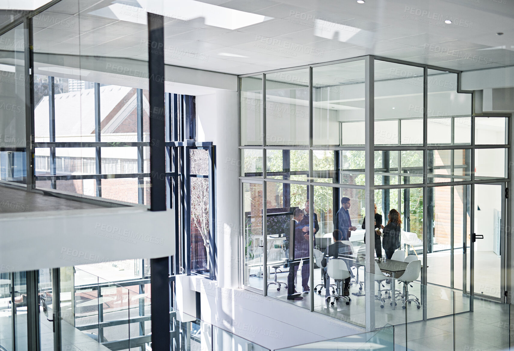 Buy stock photo Shot of corporate businesspeople meeting in the boardroom