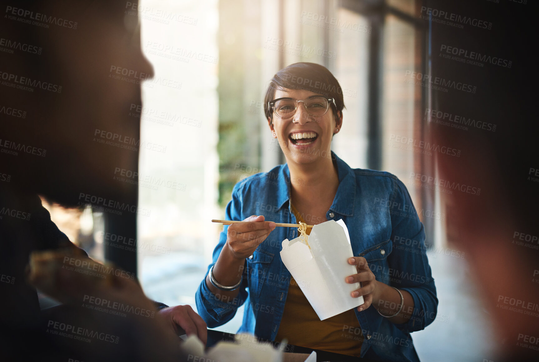 Buy stock photo Creative, business and woman in meeting with fast food, smile and planning for collaboration together. Eating, lunch and happy design team in workshop for development, growth and laughing in office