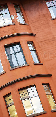 Buy stock photo Vintage apartment, building and window in city with concrete, grunge paint and wall outdoor. Glass, home exterior and facade of old architecture for design, construction or real estate property in UK