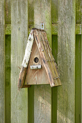 Buy stock photo Birdhouse, fence and wooden with old structure outdoor for entrance to enclosure for sanctuary. Box, building and craftsmanship with shelter in backyard or garden for conservation or ecology 