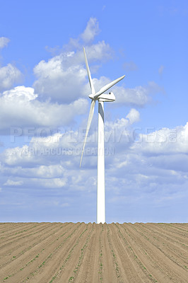 Buy stock photo Earth, landscape and sky with wind turbine for renewable energy outdoor to produce electricity. Clouds, nature and recycling with windmill in nature environment for conservation or power supply