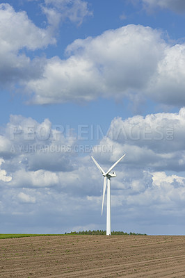 Buy stock photo Earth, clouds and landscape with wind turbine for renewable energy outdoor to produce electricity. Nature, recycling and sky with windmill in nature environment for conservation or power supply