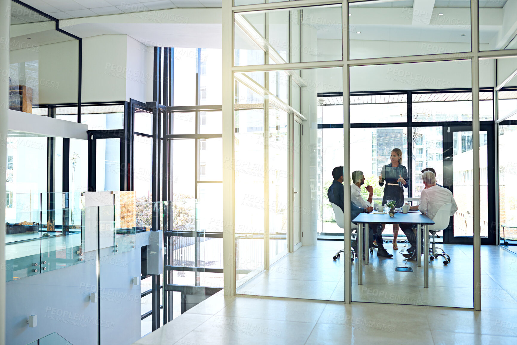 Buy stock photo Shot of a coworkers in a meeting in a modern office