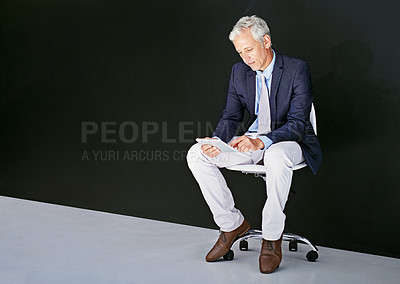 Buy stock photo Business, typing and man with tablet, connection and stock market with website info. Mature person on chair, entrepreneur and investor with tech, finance or economy news on dark studio background