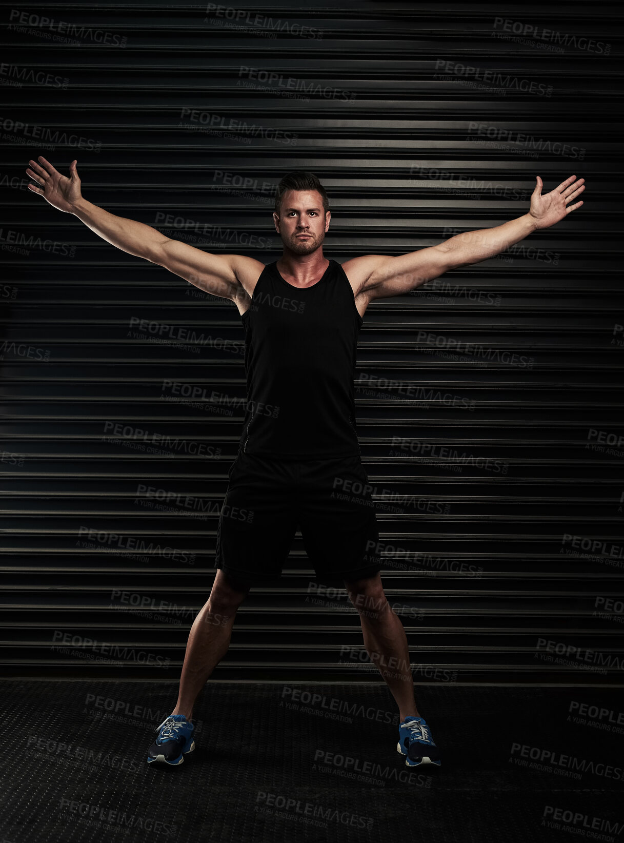 Buy stock photo Arms, open and man with portrait in gym for fitness pr exercise, healthy living and serious for wellbeing or wellness. Person, black background and determined for physical cardio or muscle strength.