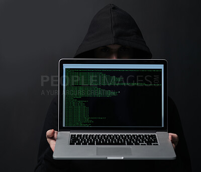 Buy stock photo Dark, hoodie and hacker in studio, laptop and fraud of cybersecurity, online and hiding with screen. Black background, scam and coding of criminal, programming and ransomware with error and person