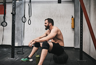 Buy stock photo Breathe, fitness and man in gym rest after intense training, exercise and workout for wellness. Sports, athlete and person with fatigue, tired and relax for health, muscle recovery and performance