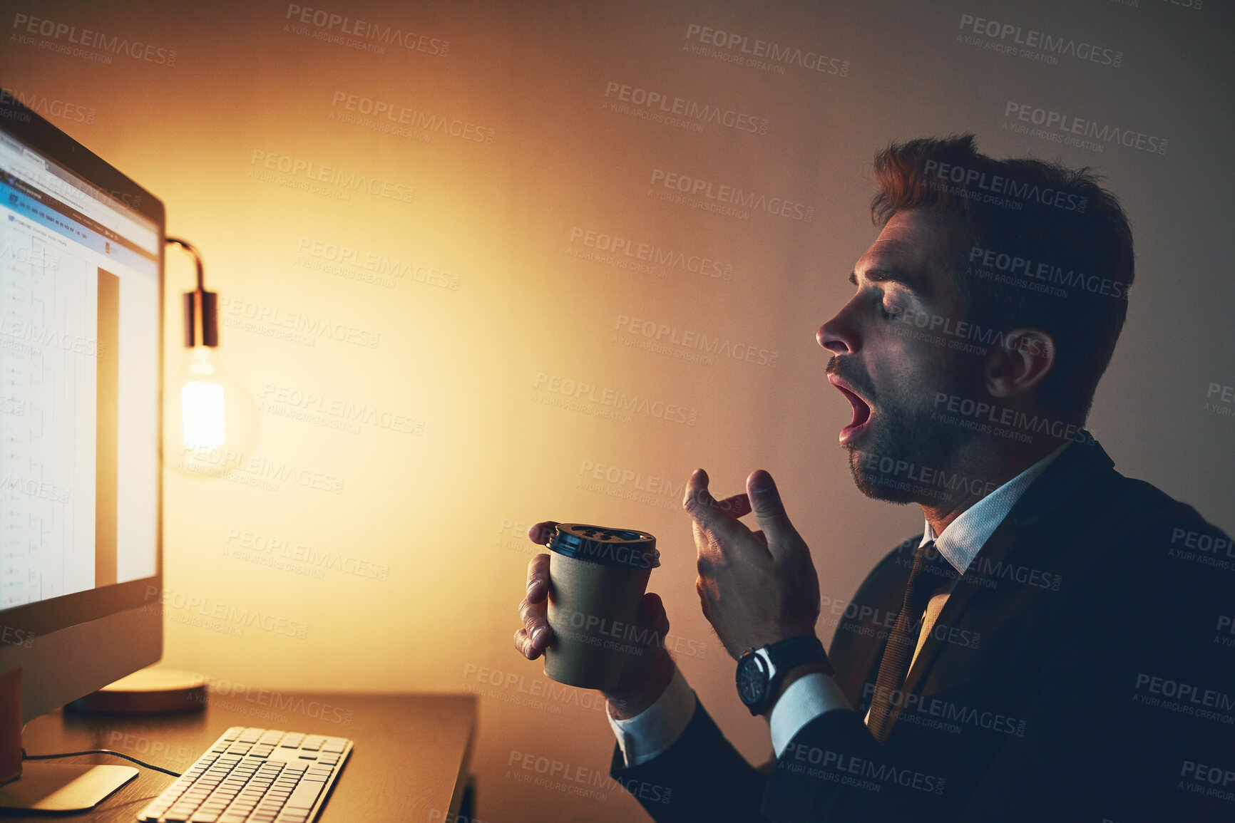 Buy stock photo Business, man and yawn with coffee in office at night with computer for trading deadline and burnout of overtime. Professional, broker and tired at desk with caffeine drink for fatigue and exhausted