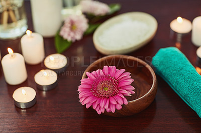 Buy stock photo Holistic, beauty and flower with bowl in spa for salon, alternative treatment and balance. Detox, skincare and zen with candles and massage therapy products for luxury, wellness and aromatherapy