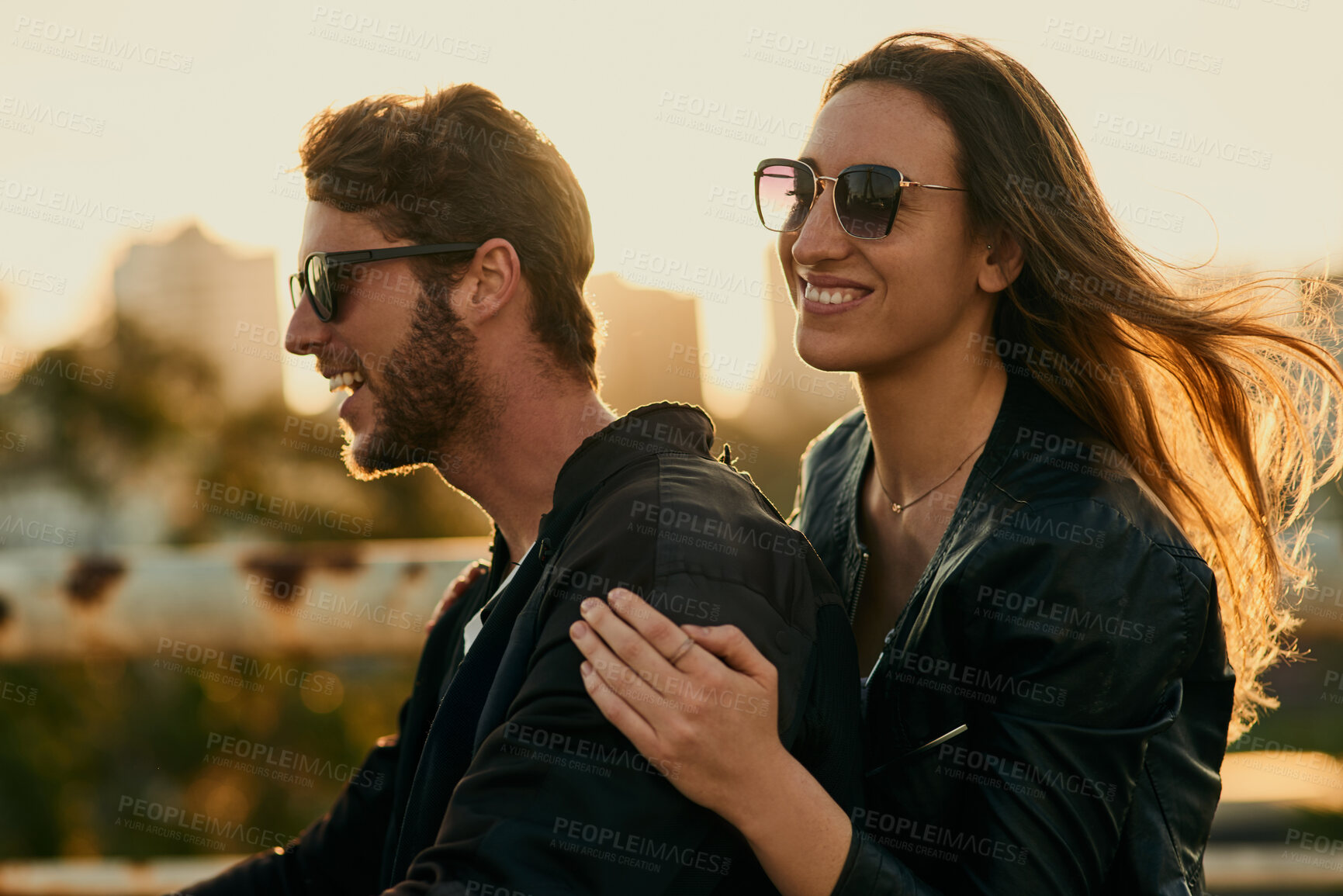 Buy stock photo Outdoor, couple and riding with smile for travel, adventure and connection with happiness in city. Relationship, man and woman with sunglasses on vacation, bonding and motorcycle for transportation