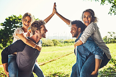 Buy stock photo Park, couple of friends and piggyback with high five for fun, support and bonding with love. People, relationship and smile or satisfied outdoor at forest for break, rest and chill or playful