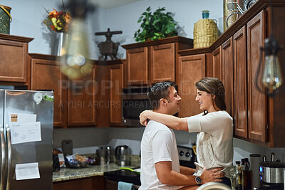 Buy stock photo House, love and couple in kitchen, smile and bonding together with relationship, romance and joy. Apartment, embrace and man with woman, marriage and morning with happiness, weekend break or cheerful