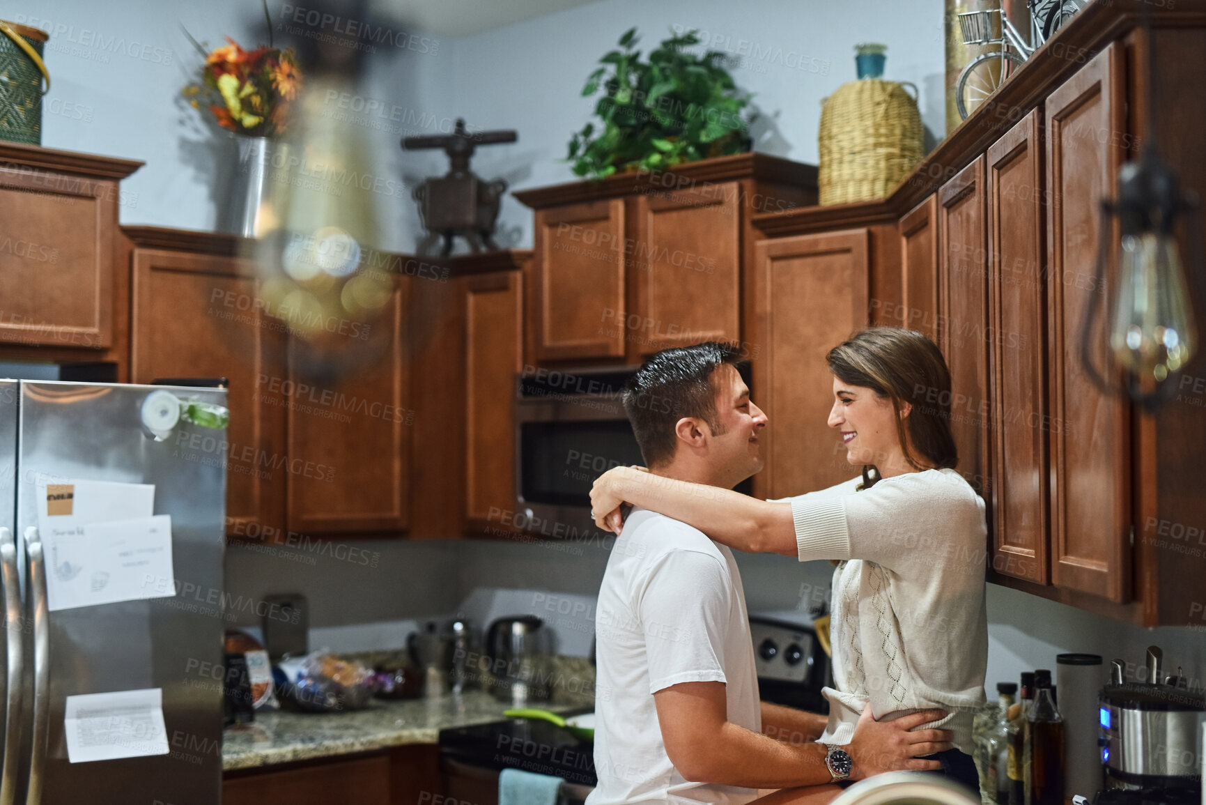 Buy stock photo House, love and couple in kitchen, smile and bonding together with relationship, romance and joy. Apartment, embrace and man with woman, marriage and morning with happiness, weekend break or cheerful