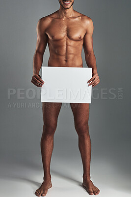 Buy stock photo Man, naked and blank board in studio for body positivity, announcement and advertising acceptance of poster. Nude, male person and billboard with muscles for self love, sexuality and gray background