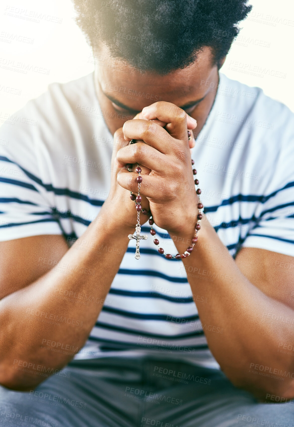 Buy stock photo Hands, rosary and praying man with religion, gratitude and connection with cross, necklace and faith. Person, Christian jewellery and spiritual meditation for forgiveness, peace or praise in morning