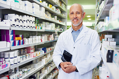 Buy stock photo Pharmacist, tablet and smile in store for medicine, inventory and trust with healthcare service. Mature man, technology and portrait in pharmacy for wellness prescription, pills and health supplement