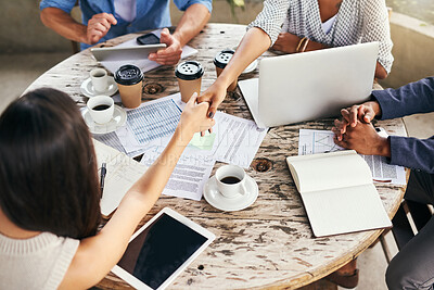 Buy stock photo Business people, meeting and above with handshake for teamwork, company mission or deal at cafe. Top view, group or employees shaking hands for agreement, partnership or introduction at coffee shop