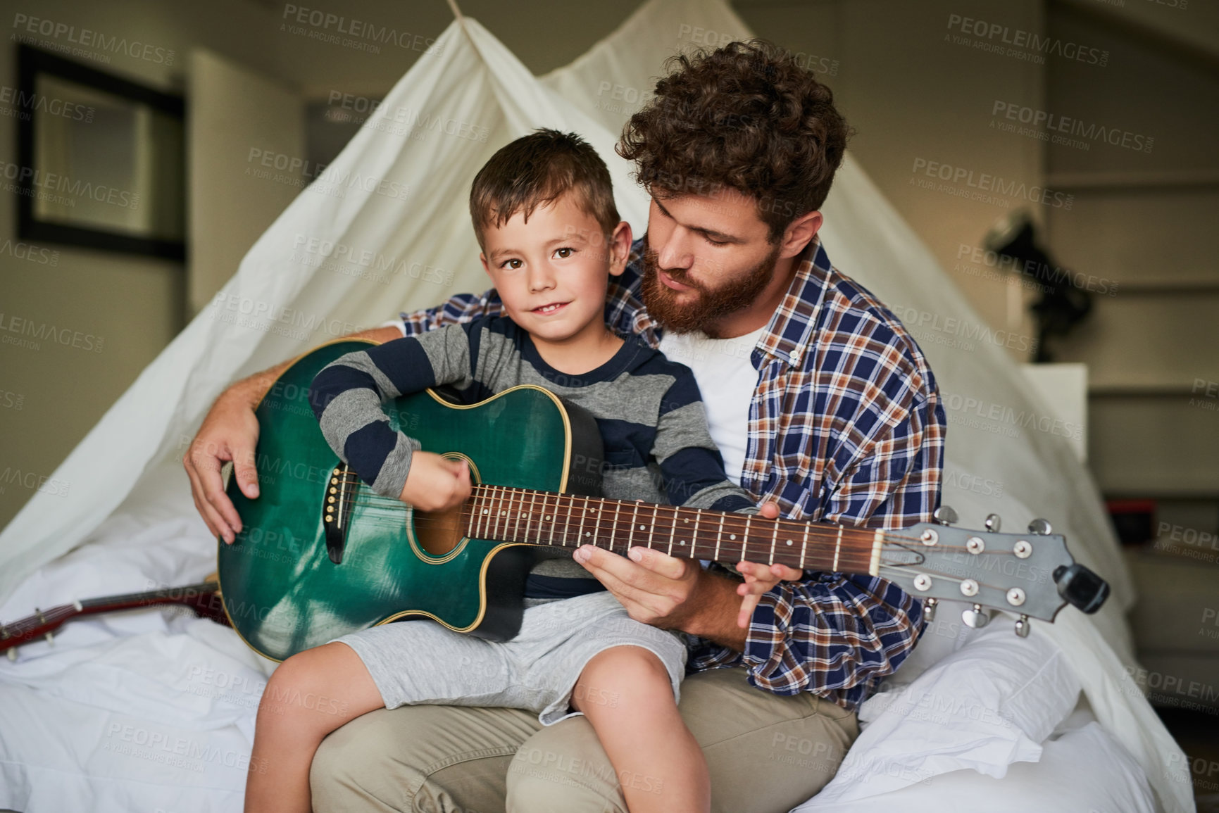 Buy stock photo Father, portrait and boy with guitar for teaching, bonding and playing together in home on weekend. Dad, face and happy child for support, development and childhood fun with love, learning and music