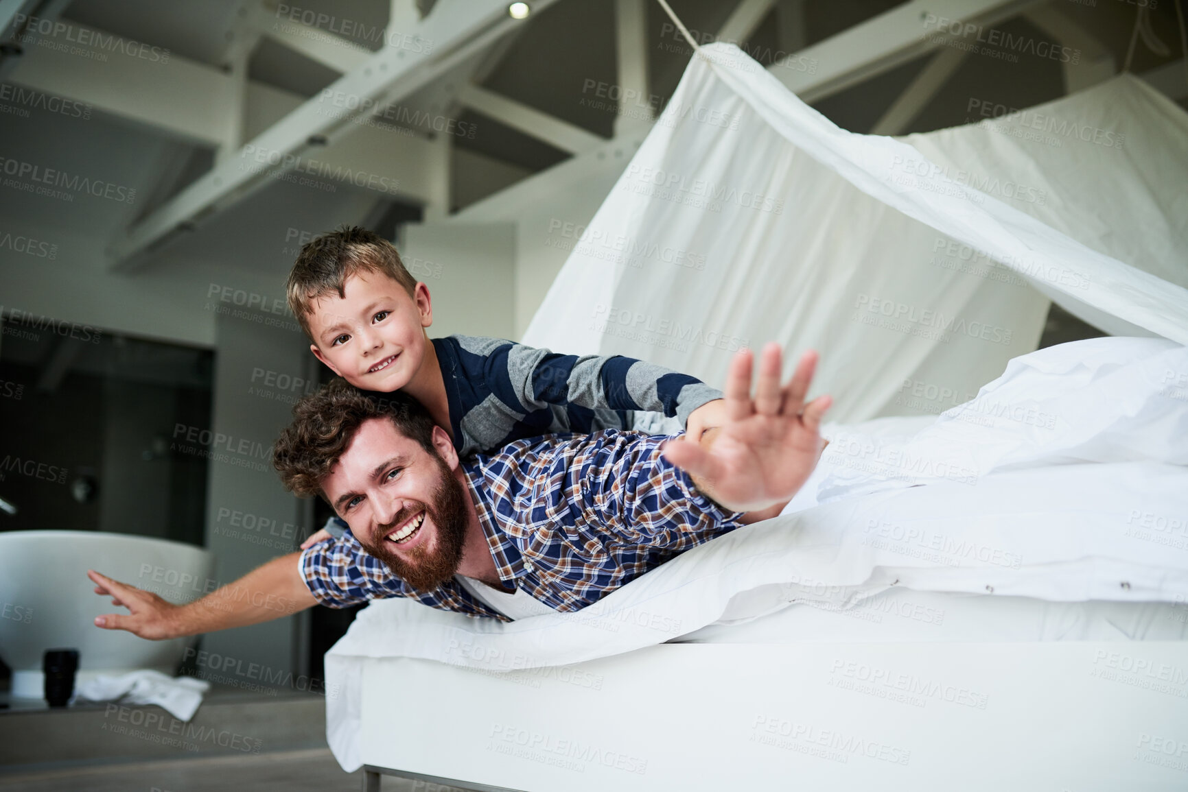 Buy stock photo Father, airplane and boy in home for bonding, relax and playing together on bed on weekend. Family, flying and happy child for support, development and childhood fun with games, plane and superhero