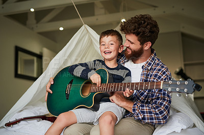 Buy stock photo Father, portrait and boy with guitar for learning, bonding and playing together in home on weekend. Dad, face and happy child for support, development and childhood fun with love, teaching and music