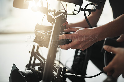 Buy stock photo Hands, equipment and camera operator for film or media production in studio for shoot, script or brief. Technology, videography and behind the scenes for movie, digital or advertising by professional