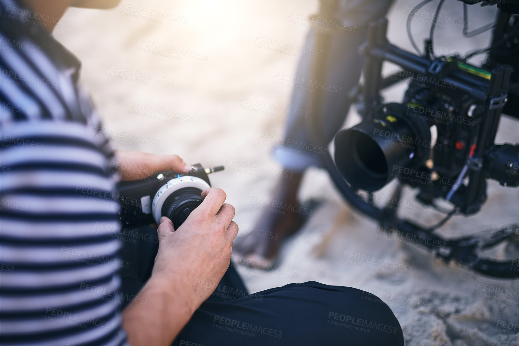 Buy stock photo Filmmaker, hands and check camera for photoshoot results, video analysis or quality control. Production process, person and settings for nature, movie or videography with professional gear on beach