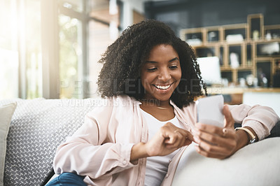 Buy stock photo Relax, scroll and woman on sofa with phone, smile and online chat on calm morning in home. Smartphone, reading and girl on couch with search on mobile app for social media, connection and networking