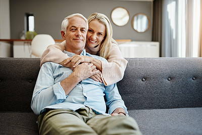 Buy stock photo Hug, portrait and senior couple with love, healthy relationship and loyalty to partner in home on sofa. Face, mature man and happy woman embrace together for trust, support and holding hands in USA