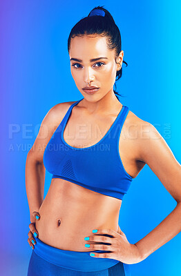 Buy stock photo Fitness, serious and portrait of woman on blue background for health, wellness and active in studio. Personal trainer, yoga instructor and isolated person for exercise, training and workout for gym