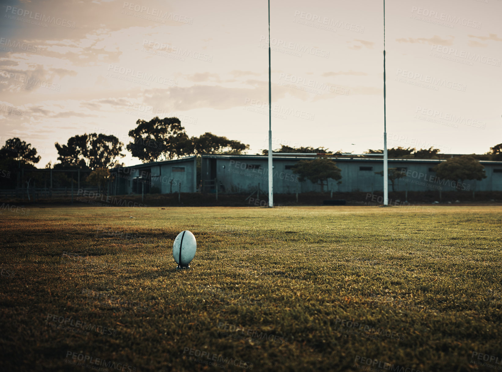 Buy stock photo Rugby, ball and field with sport, training and fitness pitch for kick exercise with goal post outdoor. Morning, practice and  school ground with game equipment and gear for match on grass at club