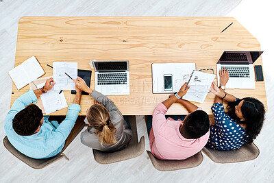 Buy stock photo Business people, laptop and above with documents on wooden table for planning or brainstorming at office. Top view, creative designers or employees with paperwork or computer for project discussion