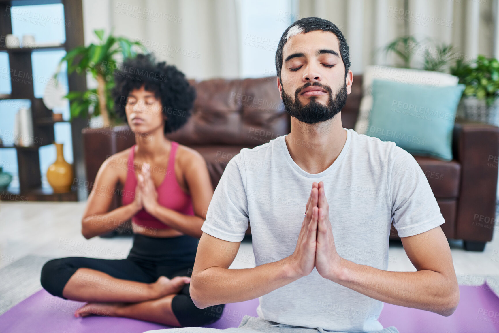 Buy stock photo Namaste, yoga and man in home for meditation, mindfulness exercise or prayer hands. Relax, interracial couple or breathe for peace, calm or spiritual wellness for body health, zen or fitness together