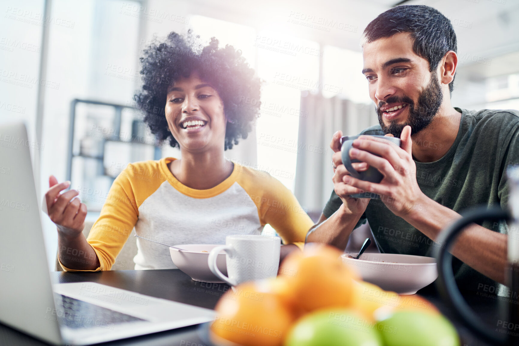 Buy stock photo Laptop, couple and coffee break in home kitchen, bonding and streaming funny comedy at table. Man, woman and happy people on social media, online browsing or scrolling for comic meme or video