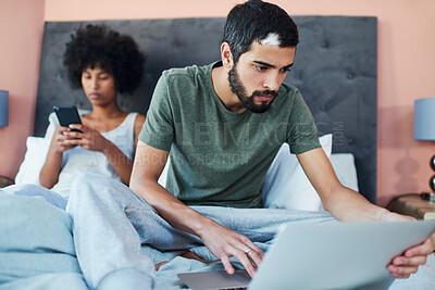 Buy stock photo Couple, man and laptop on bed in home for checking email, morning routine and scrolling on social media. Interracial people, wake up and technology in bedroom for reading news and searching internet 