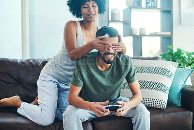 Buy stock photo Man, woman and video game with covering eyes for esports, funny and playful in home for bonding. Couple, controller and together in living room on weekend for relationship, happiness and connection