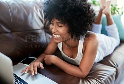 Buy stock photo Happy, black woman and relax with laptop on sofa for online browsing, social media or streaming at home. Young African, female person or user with smile, afro or computer on couch for app at house