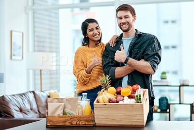 Buy stock photo Grocery, thumbs up and portrait with couple in house for success, shopping and supermarket deal. Nutrition, food and wellness with man and woman at home for consumer, fruit and store savings