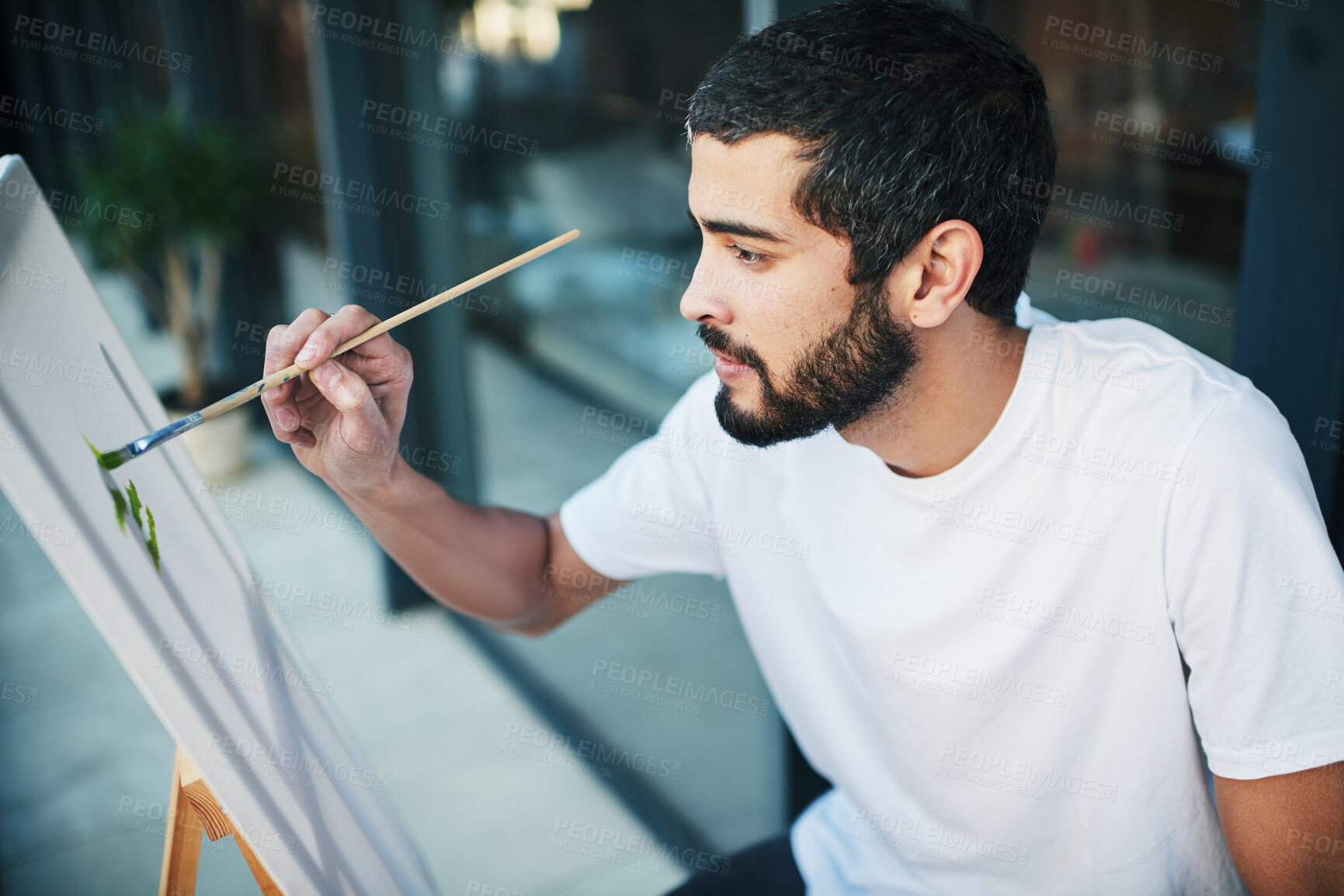 Buy stock photo Art, canvas and painting with man on balcony of home for creativity, expression or inspiration outdoor. Paintbrush, relax and wellness with painter person at apartment for hobby or craft on easel