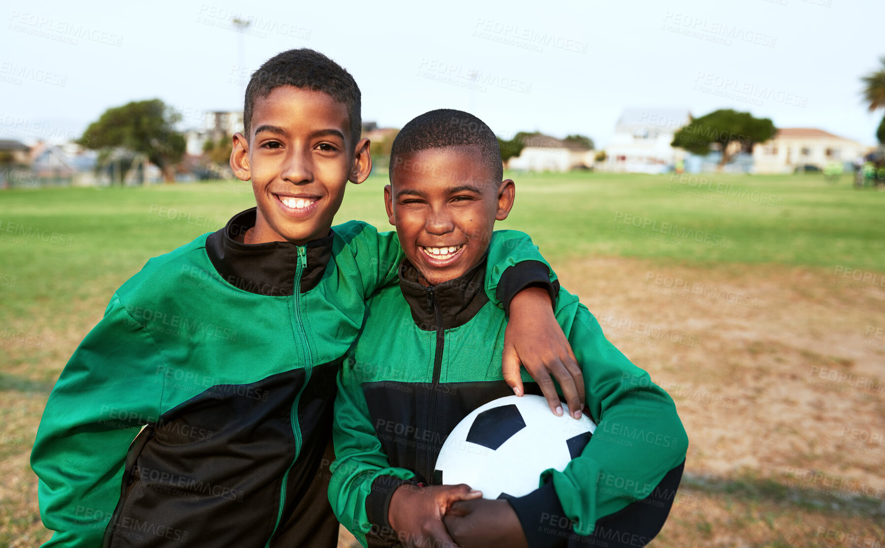 Buy stock photo Happy boys, portrait and hug with soccer ball for sports, match or team game together on grass field. Young male person, athlete or football players with smile for youth or childhood development