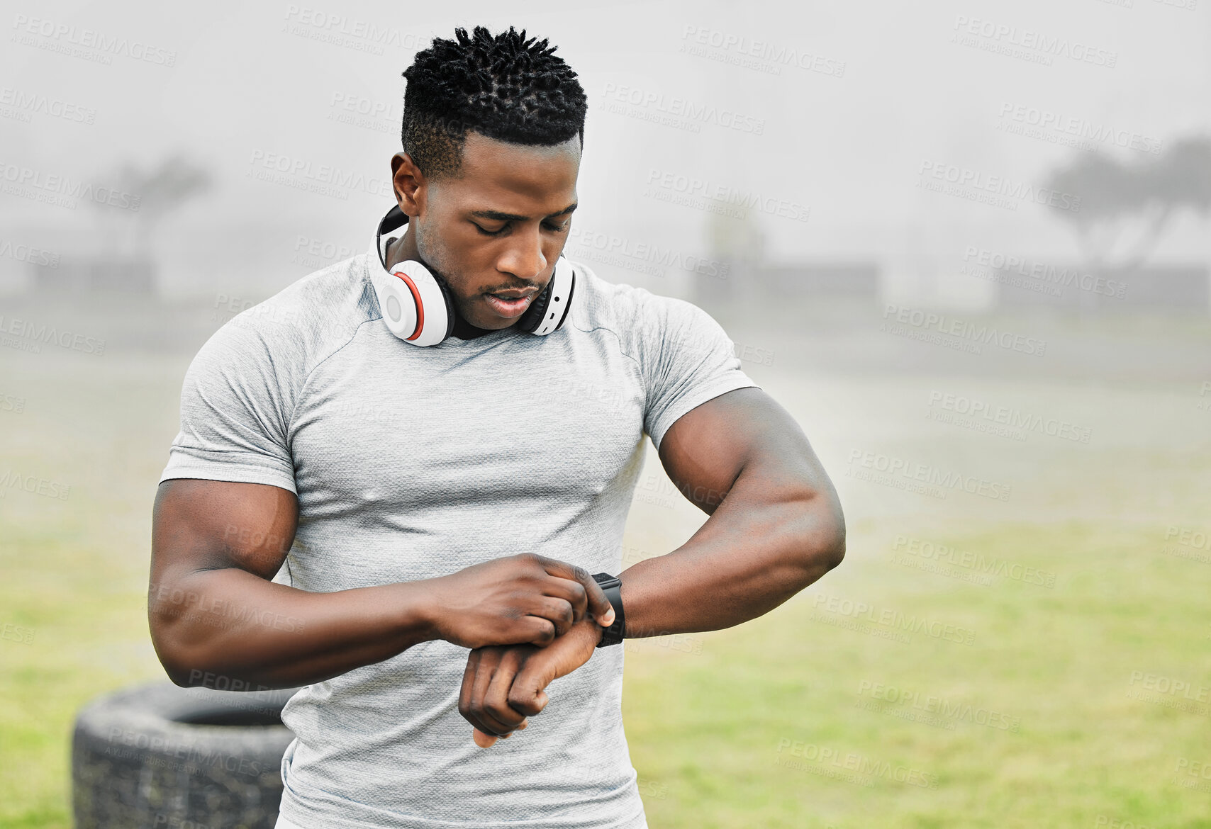 Buy stock photo Black man, exercise and smart watch with sports person outdoor, checking the time during a workout. Arm, fitness and technology with athlete tracking cardio or endurance performance while training