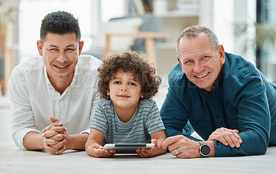 Buy stock photo Portrait, child and grandfather with dad, tablet and bonding of family, floor and watching video. Elearning, growth and development of boy, online and reading of ebook, old man and father in house